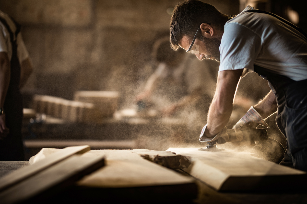 Image of man woodworking.