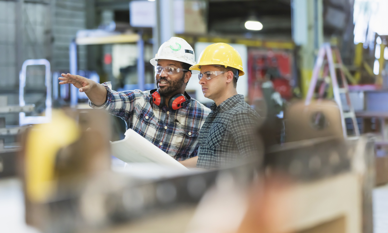 Image of two men in hard hats.