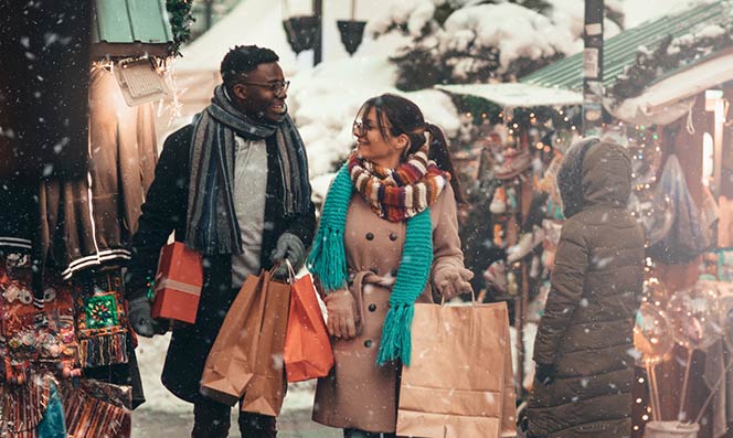 Couple shopping and walking in the snow.