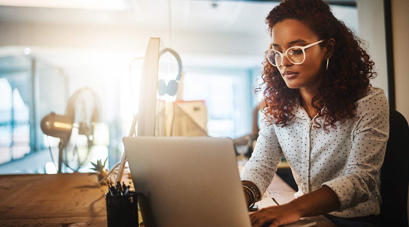 Image of woman at a computer.