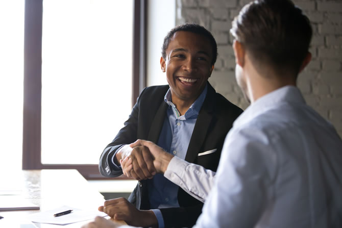 Image of gentlemen shaking hands.